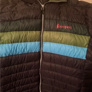 cotopaxi Black Puffer Jacket with Green and Blue Stripes